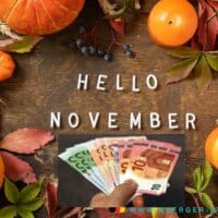 Herbstfrüchte mit Schrift Hello November und Geldscheinen