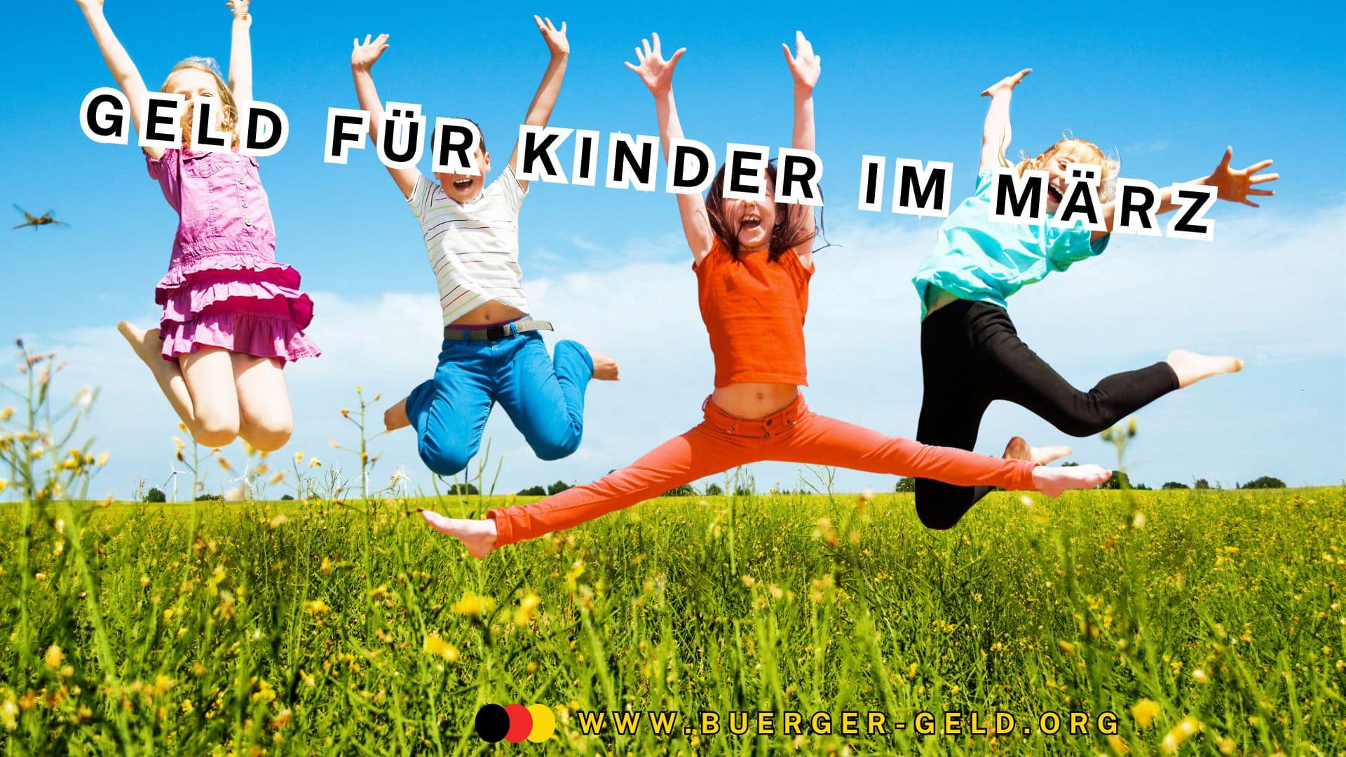 Kinder springen auf einer Wiese